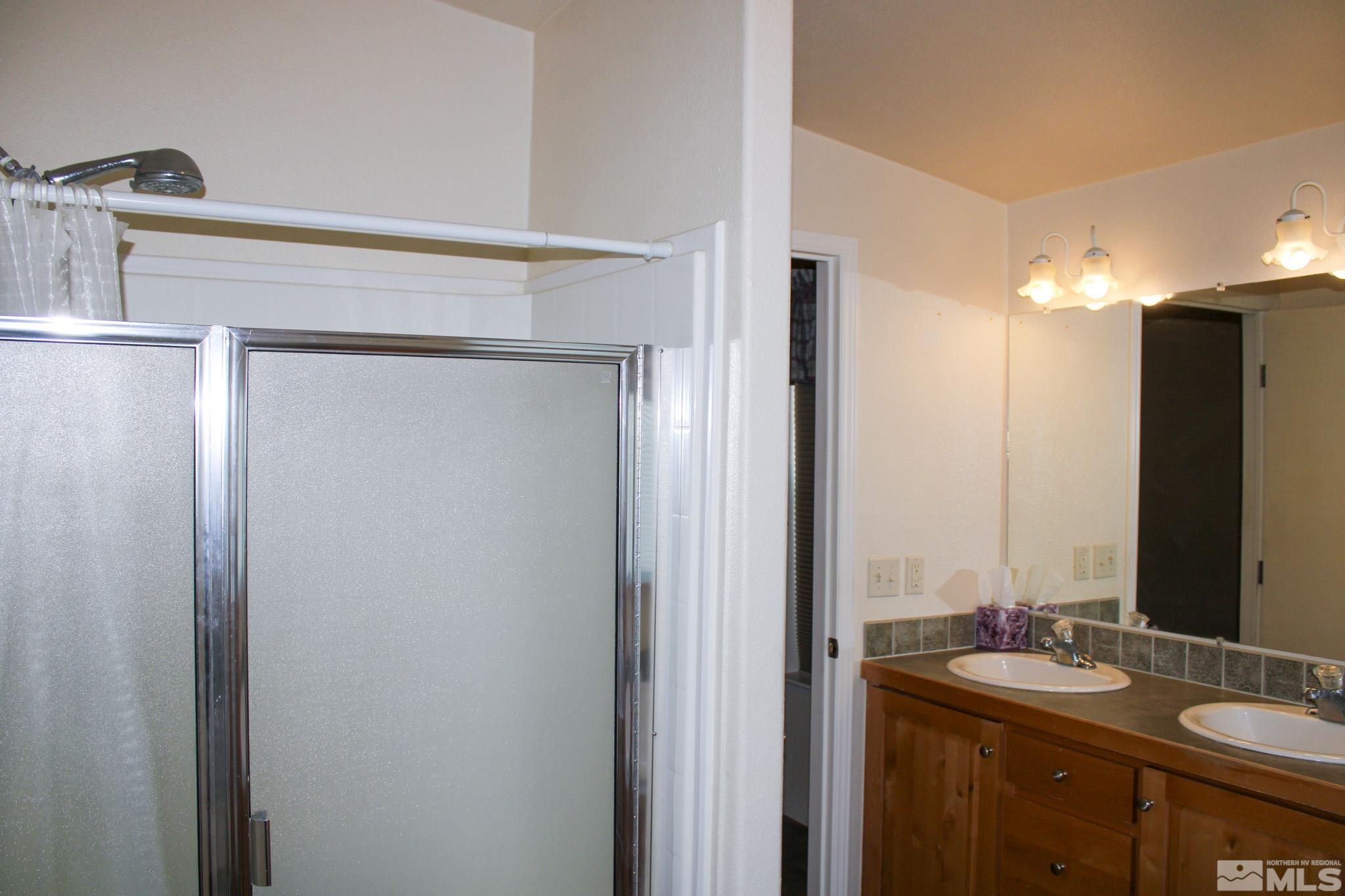 1850 Pam's Place Fallon, NV 89406 - Photo 20 of 40 a bathroom with a sink and a mirror