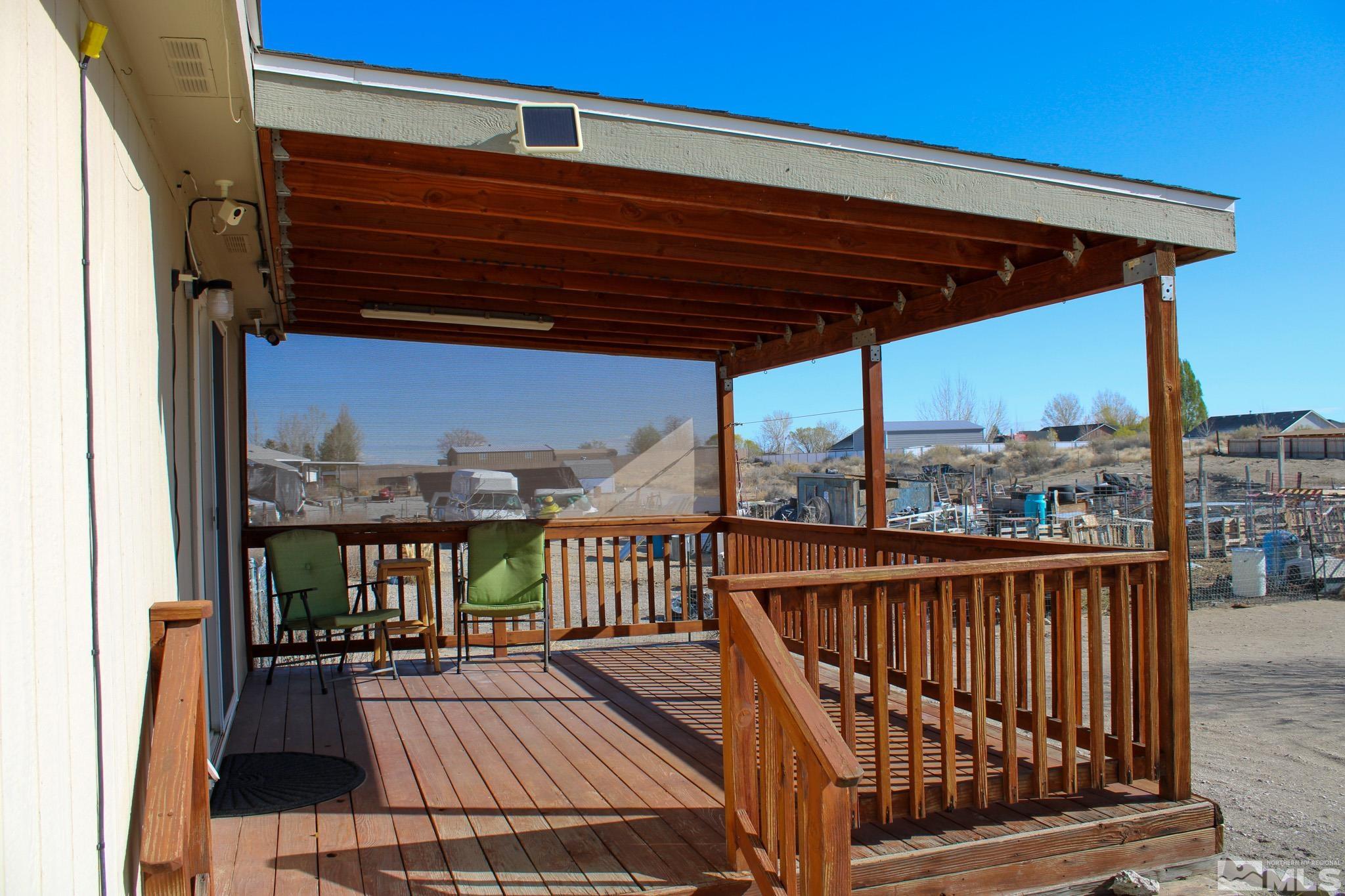 1850 Pam's Place Fallon, NV 89406 - Photo 27 of 40 a view of balcony with wooden floor and outdoor seating