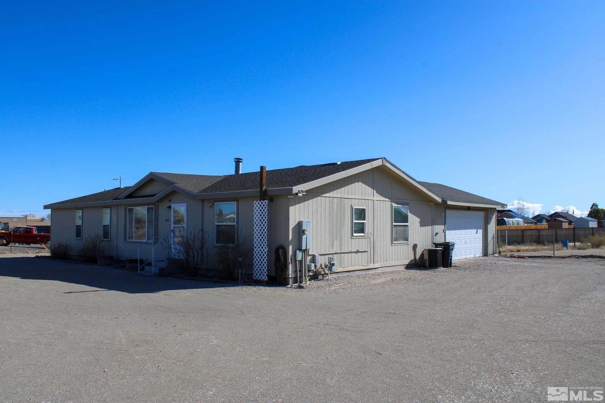 1850 Pam's Place Fallon, NV 89406 - Photo 36 of 40 a view of a house with a yard and large trees