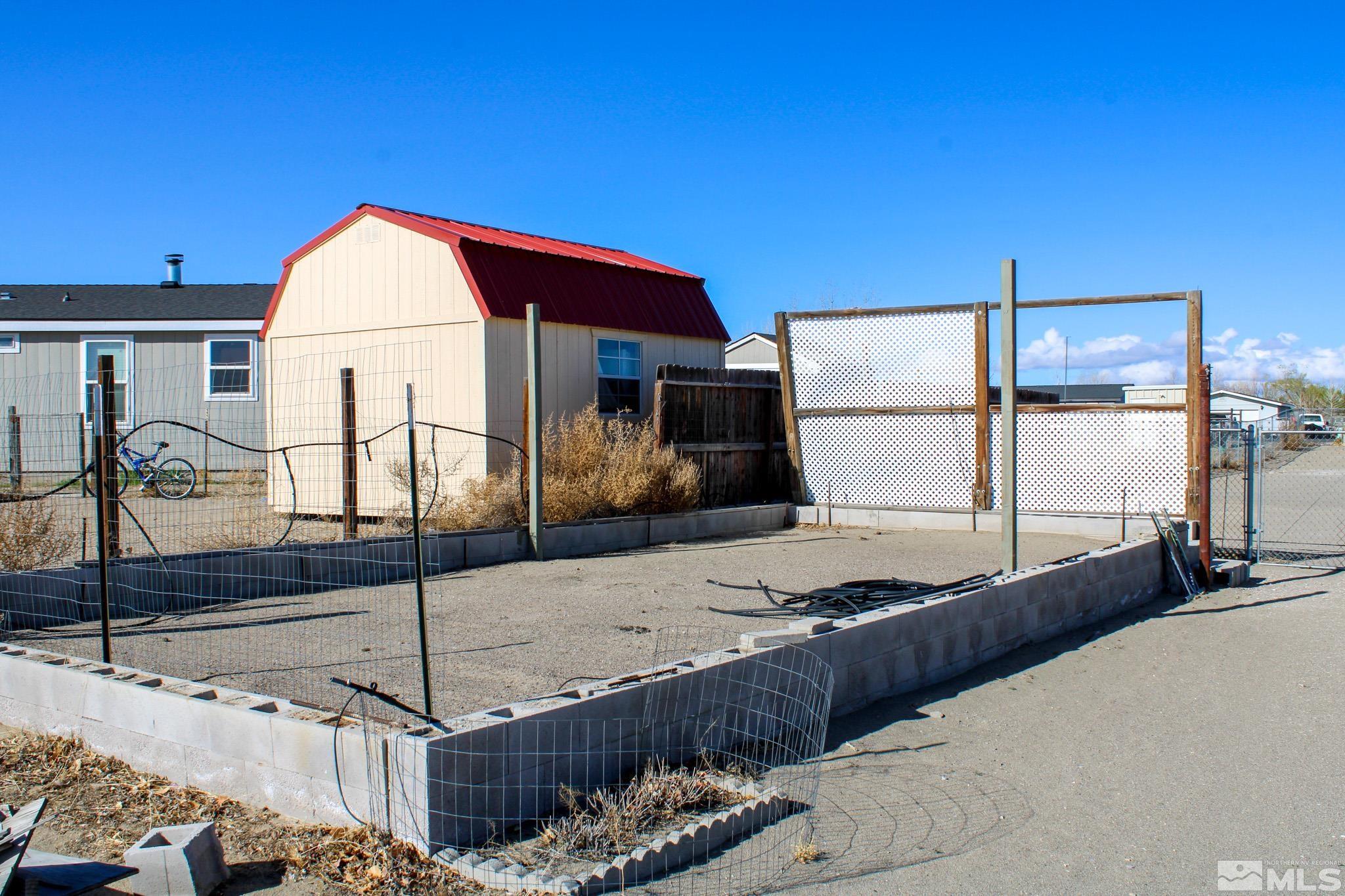 1850 Pam's Place Fallon, NV 89406 - Photo 40 of 40 a front view of a house with garden