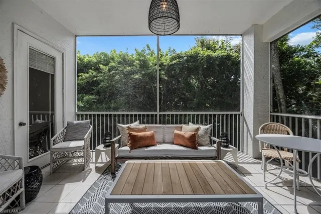 a view of balcony with furniture