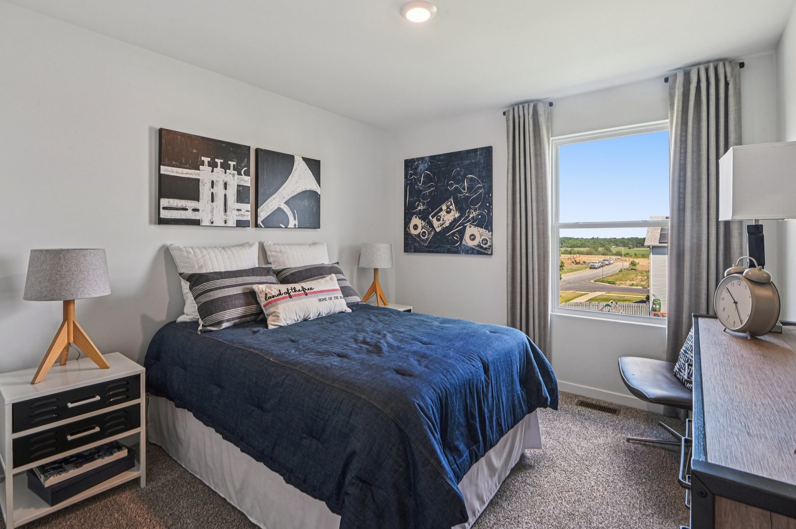 494 Arbor Ridge Drive Hampshire, IL 60140 - Photo 17 of 46 a bedroom with a bed and a lamp on dresser with wooden floor