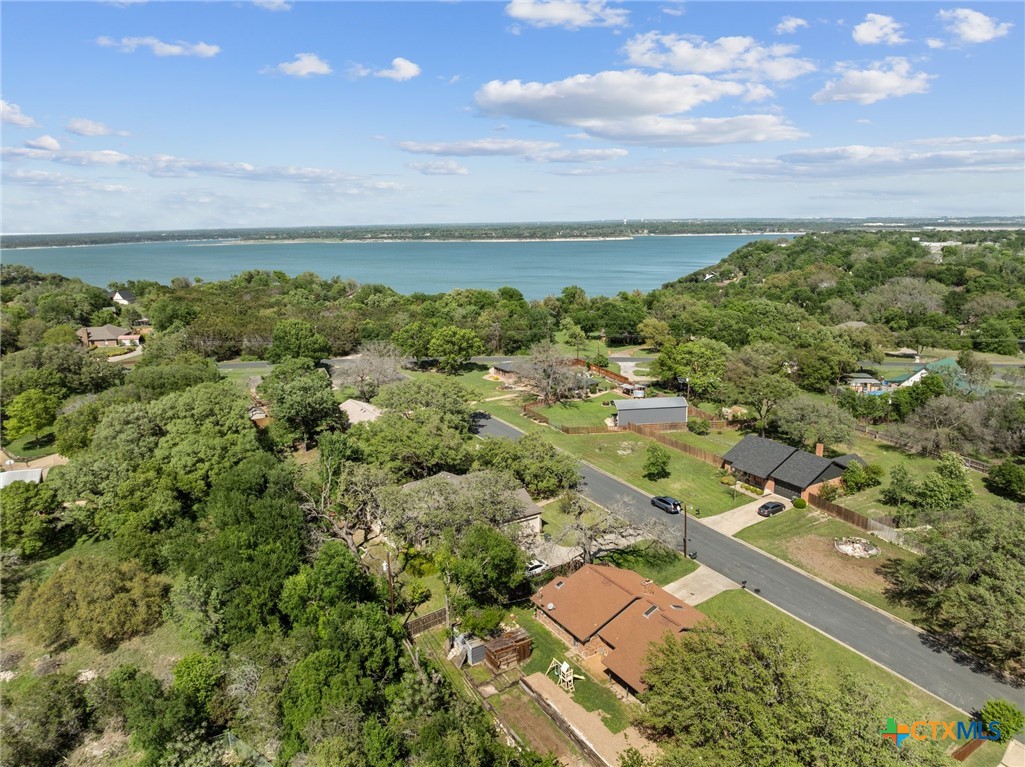 an aerial view of a residential houses with outdoor space