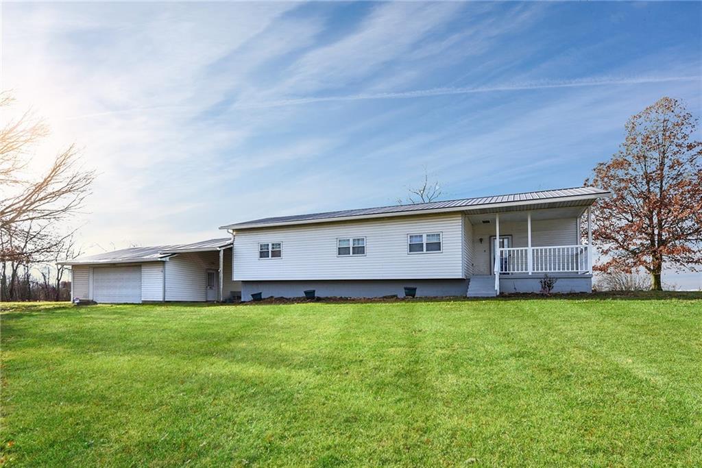 4 Malone Ridge Road Washington, PA 15301 - Photo 34 of 34 a view of a house with a big yard potted plants and large tree