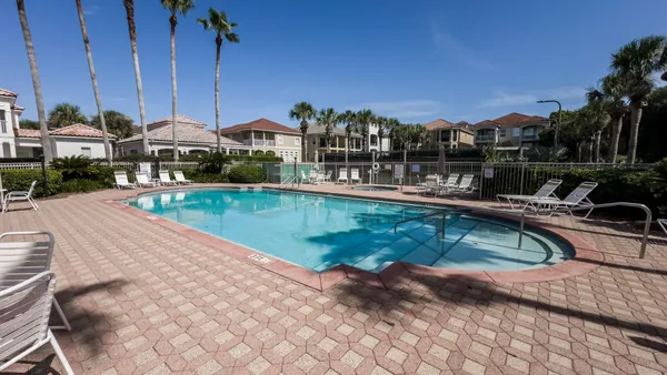 a view of a swimming pool with a lounge chairs