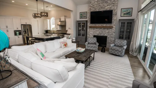 a living room with furniture fireplace and flat screen tv