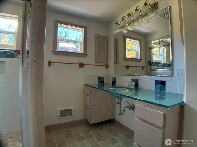 a kitchen with a sink and a window