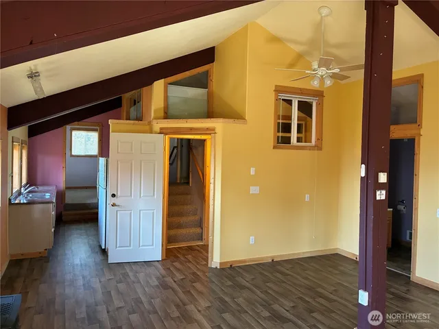 a view of a yard in front of the house with outdoor seating