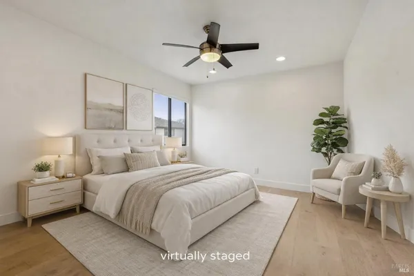 a bedroom with a bed and a chair