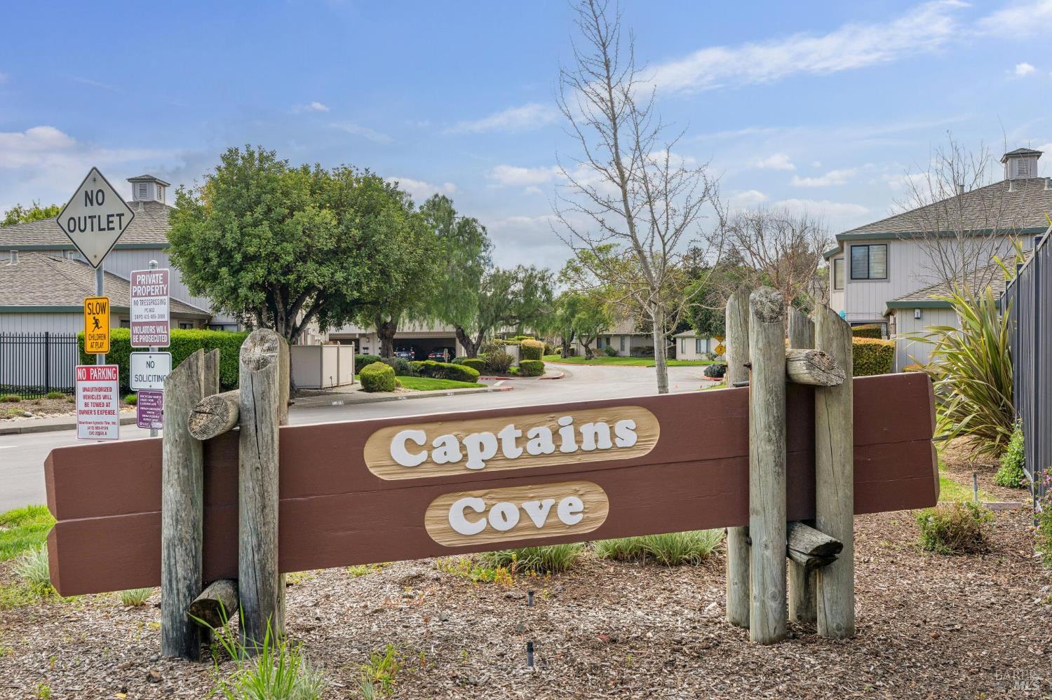 95 Dockside Circle San Rafael, CA 94903 - Photo 3 of 7 a sign that is on the side of the road