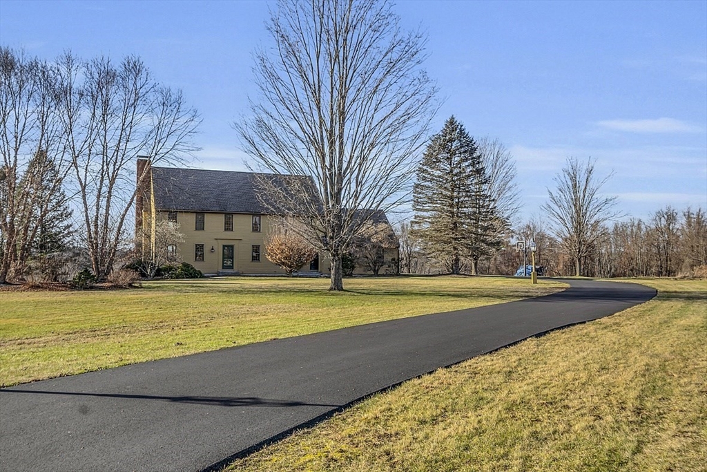 332 Still River Road Harvard, MA 01451 - Photo 2 of 42 a view of a swimming pool with an outdoor space and seating area