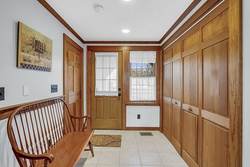 332 Still River Road Harvard, MA 01451 - Photo 25 of 42 a view of a hallway with wooden floor and windows