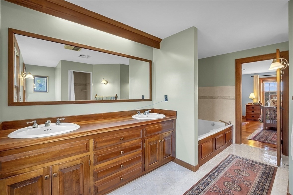 332 Still River Road Harvard, MA 01451 - Photo 29 of 42 a spacious bathroom with a granite countertop sink and a mirror
