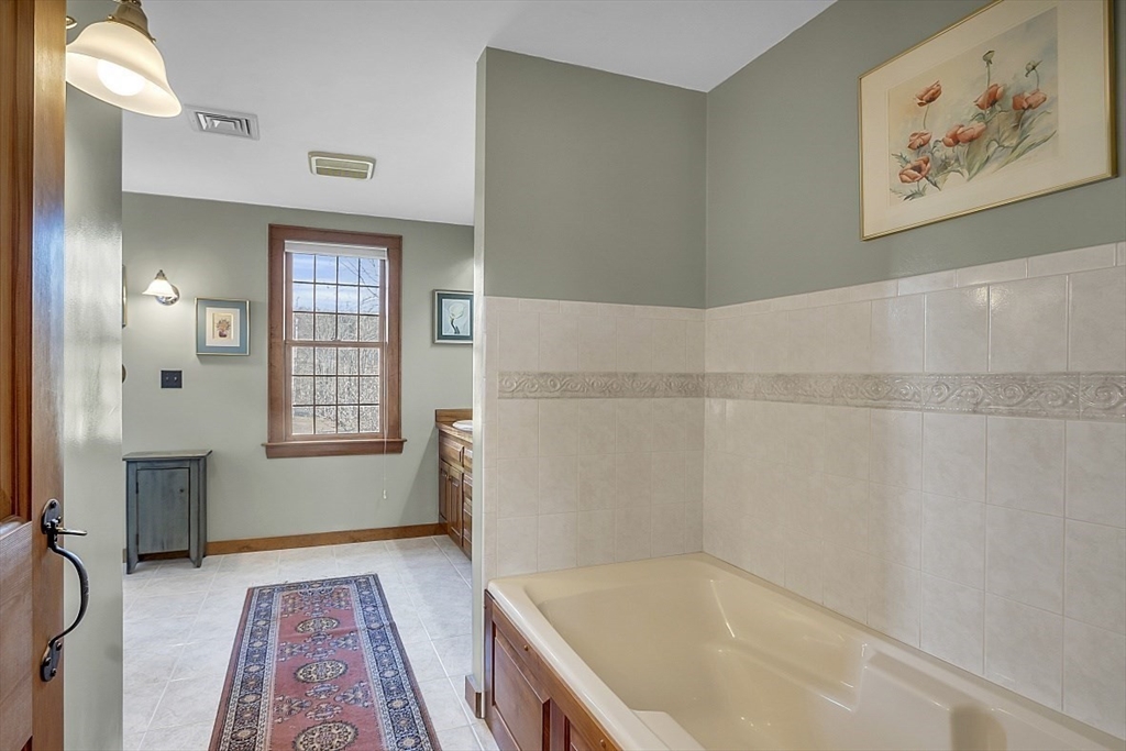 332 Still River Road Harvard, MA 01451 - Photo 30 of 42 a bathroom with a bathtub and a shower