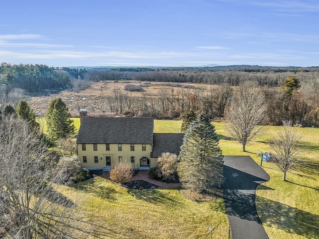 332 Still River Road Harvard, MA 01451 - Photo 38 of 42 a view of a lake with a mountain in the background