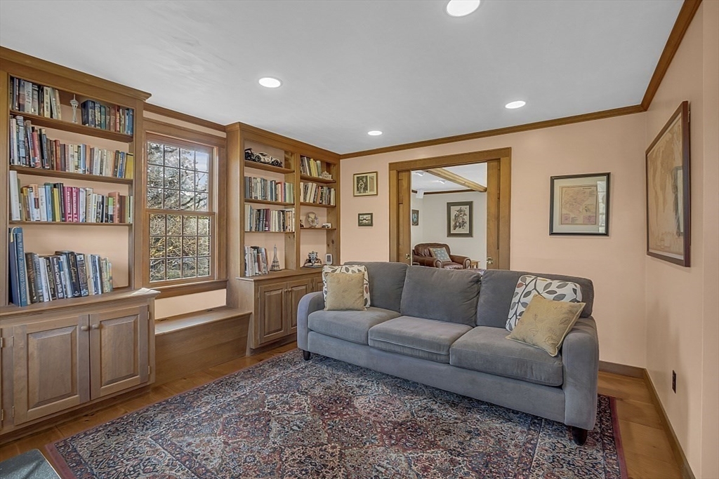 332 Still River Road Harvard, MA 01451 - Photo 7 of 42 a living room with furniture and a book shelf