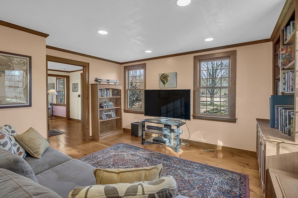 332 Still River Road Harvard, MA 01451 - Photo 8 of 42 a living room with furniture and a flat screen tv