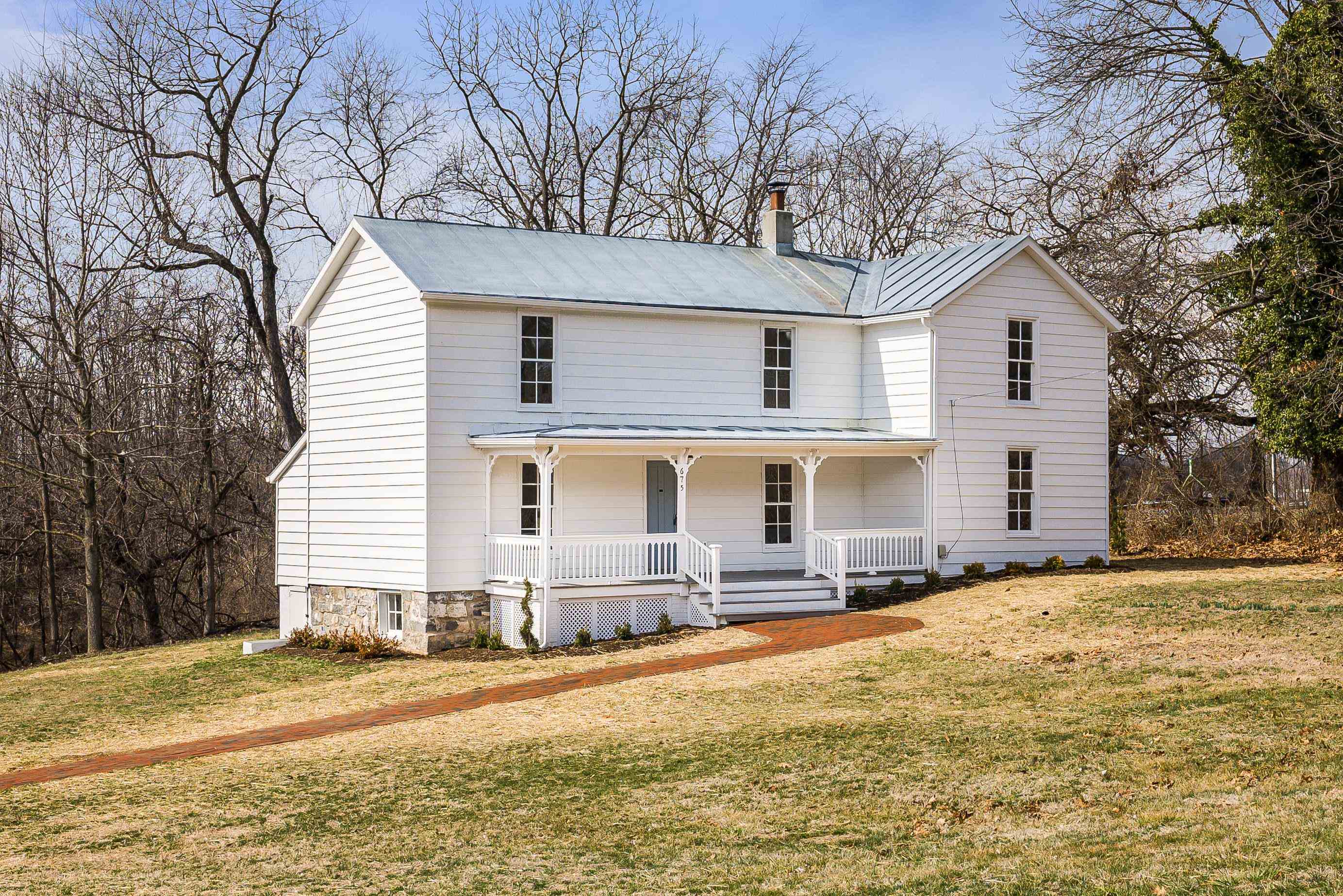 675 Stone Spring Road Harrisonburg, VA 22801 - Photo 2 of 39 a front view of house with yard and trees in the background