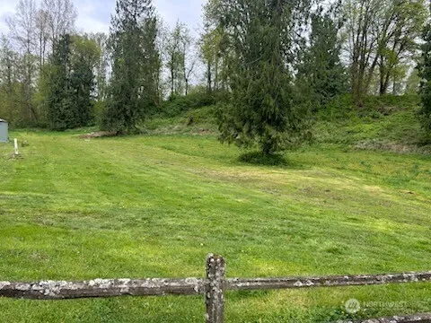 a backyard of a house with lots of green space