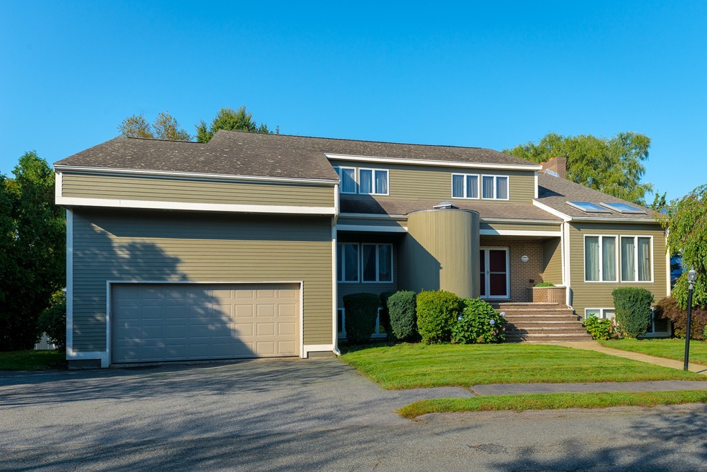 16 Lehman Road Marblehead, MA 01945 - Photo 1 of 21 a front view of a house with a yard and garage