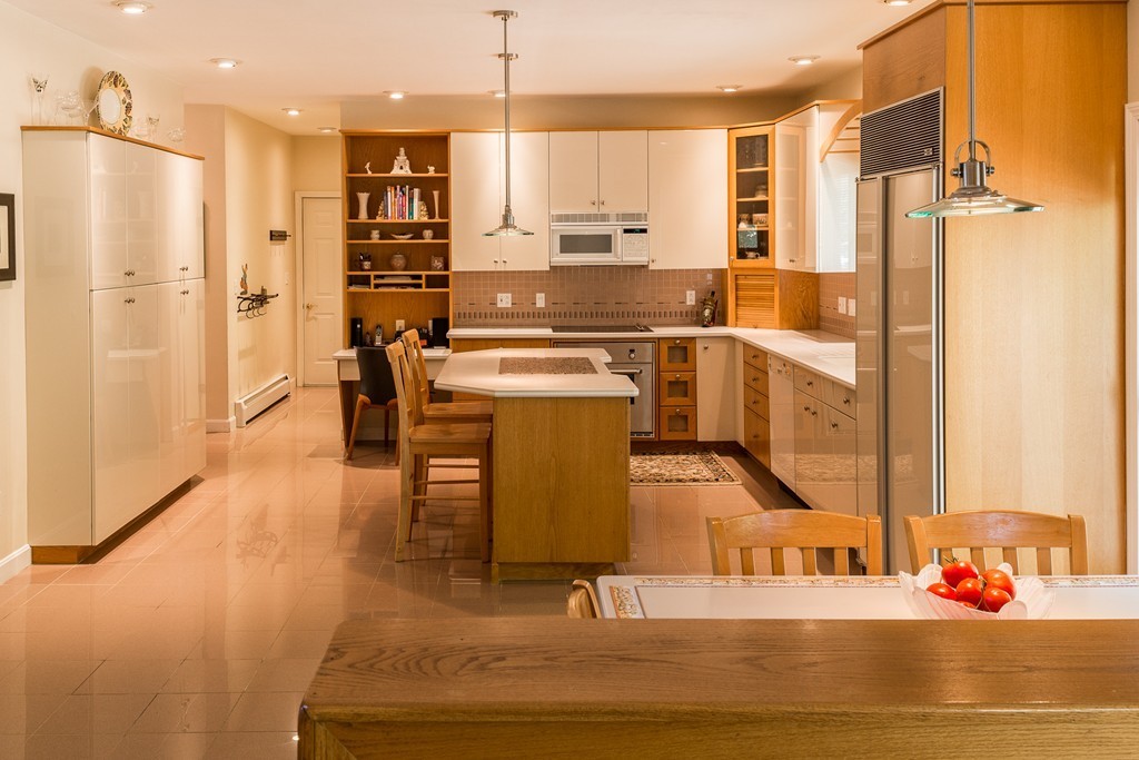 16 Lehman Road Marblehead, MA 01945 - Photo 4 of 21 a kitchen with stainless steel appliances granite countertop a refrigerator and a stove