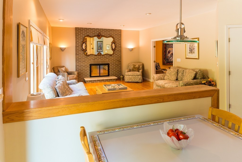 16 Lehman Road Marblehead, MA 01945 - Photo 5 of 21 a living room with fireplace furniture and a chandelier