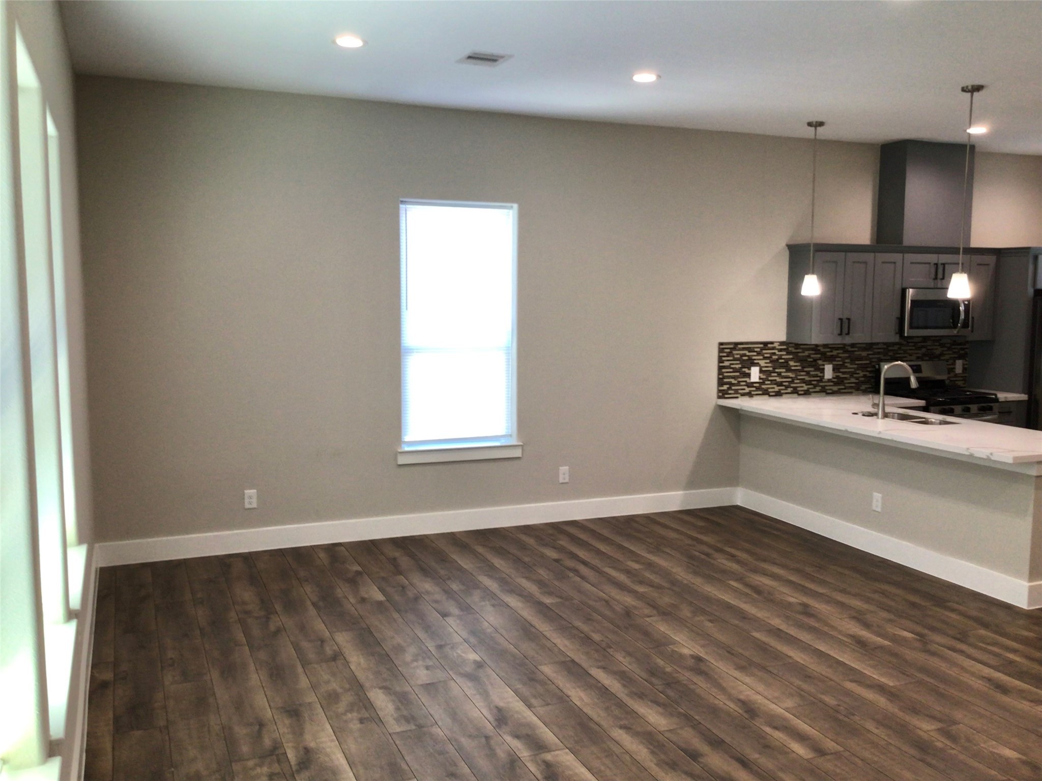 2109 Marnel Road, Unit E Houston, TX 77055 - Photo 11 of 29 a view of a kitchen with a sink and a window