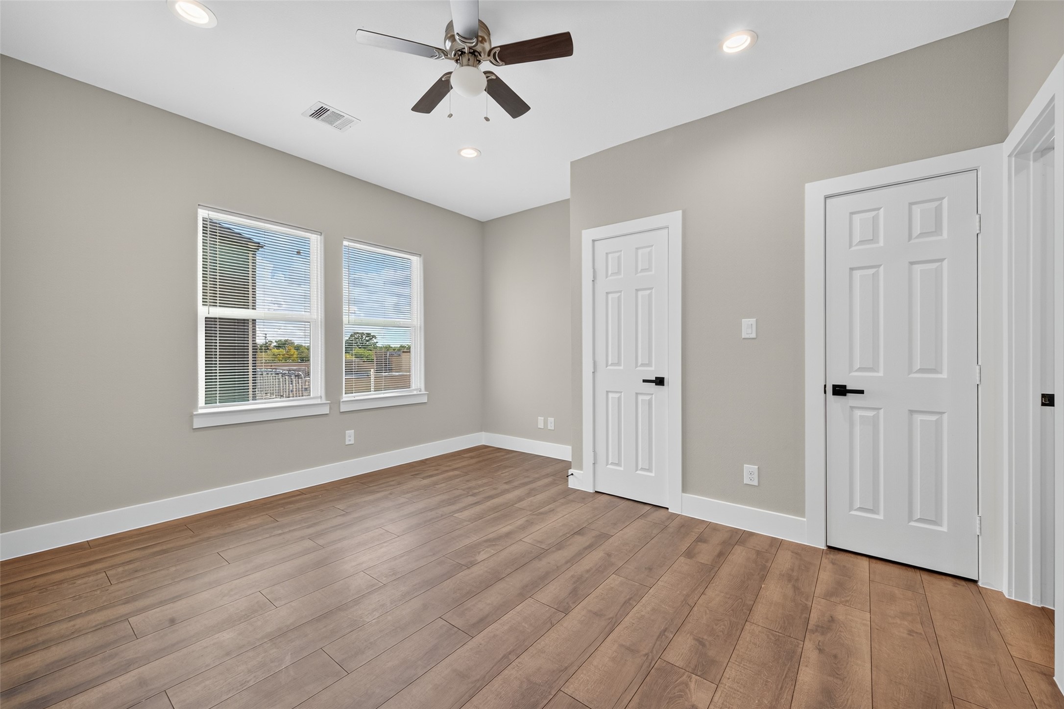 2109 Marnel Road, Unit E Houston, TX 77055 - Photo 13 of 29 wooden floor in an empty room with a window