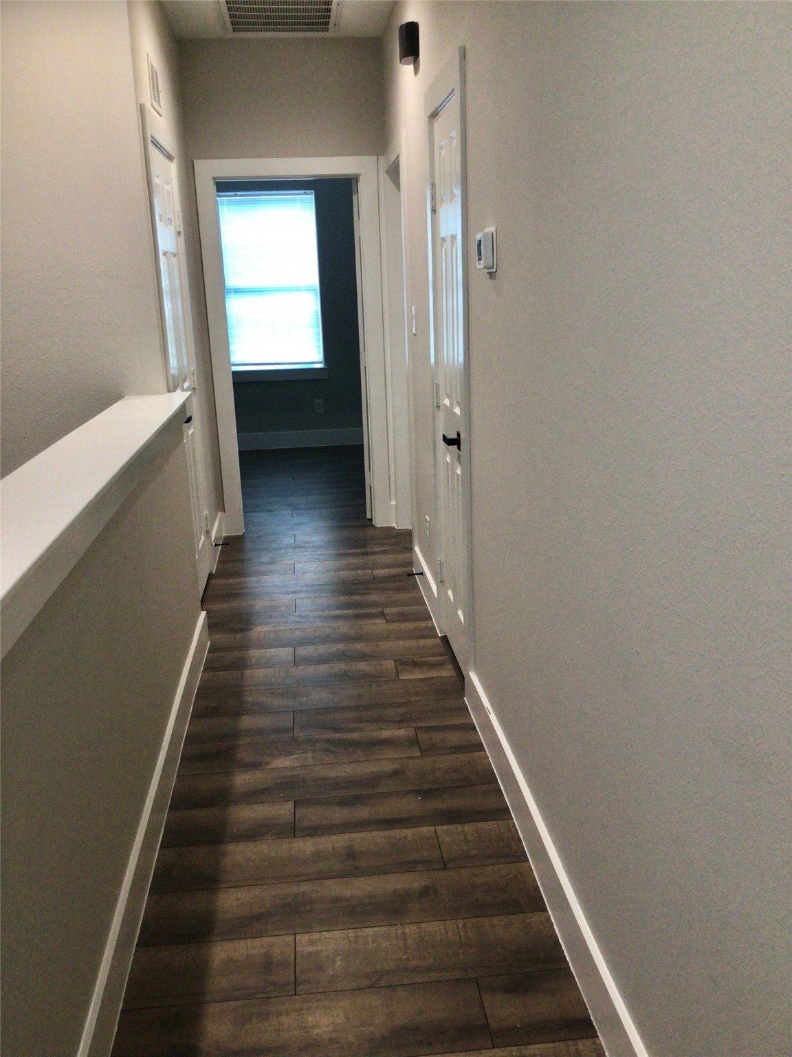 2109 Marnel Road, Unit E Houston, TX 77055 - Photo 17 of 29 a view of a hallway with wooden floor and entryway