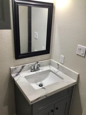 a bathroom with a sink and a toilet