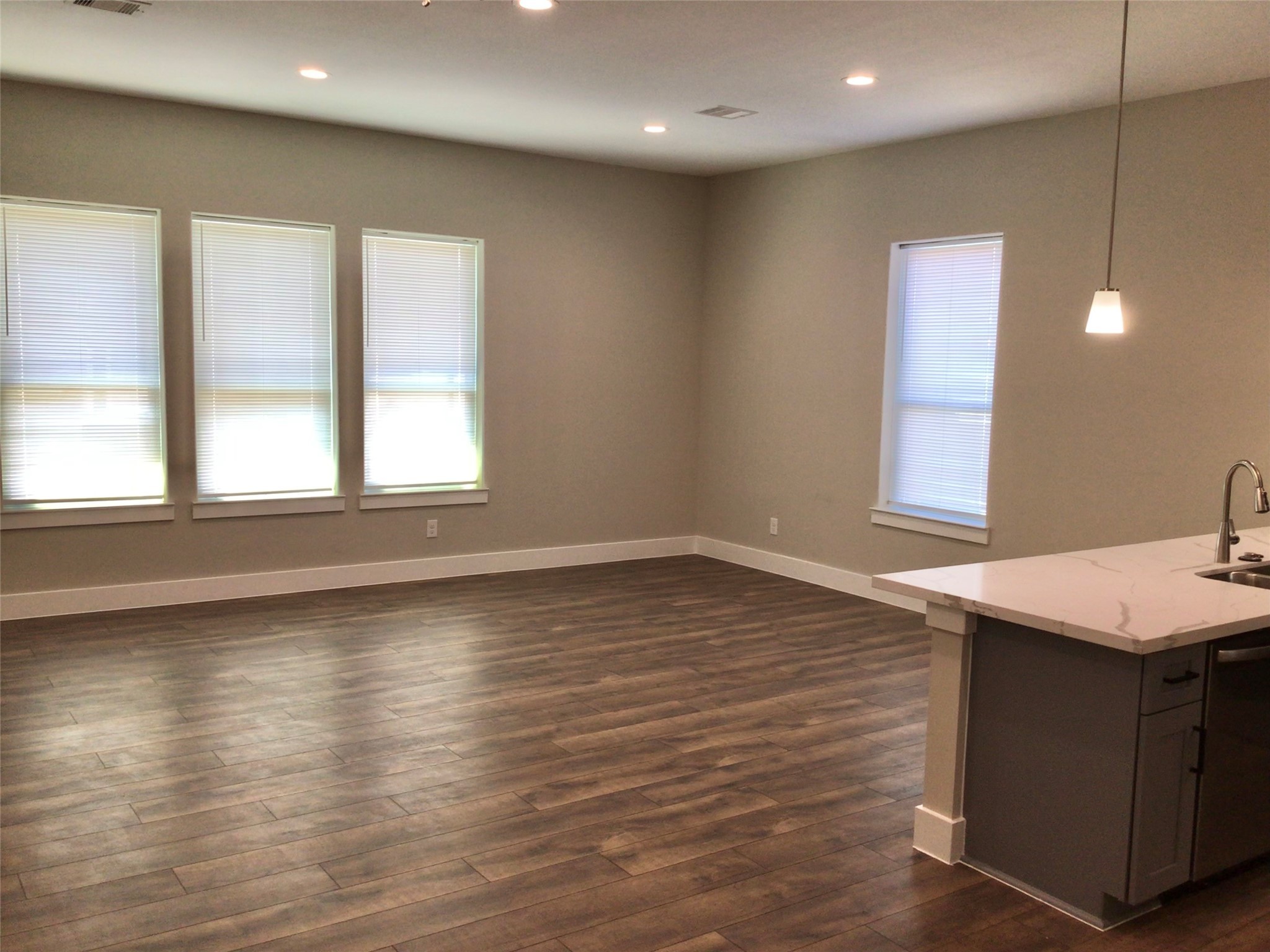 2109 Marnel Road, Unit E Houston, TX 77055 - Photo 10 of 29 a view of a kitchen with a sink and wooden floor