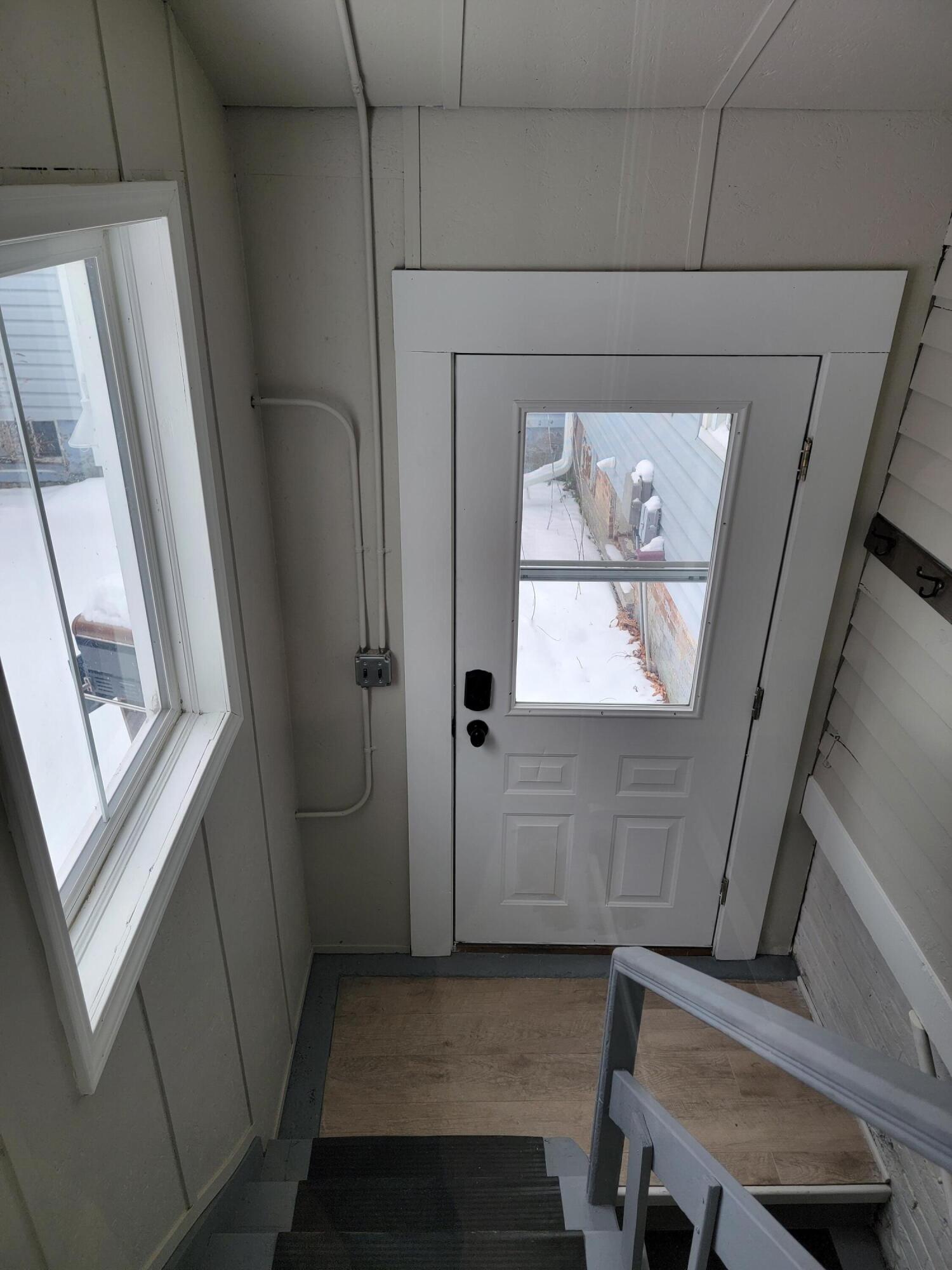 418 2nd Street, Unit 2 Manistee, MI 49660 - Photo 16 of 20 Back Entrance & stairs to basement