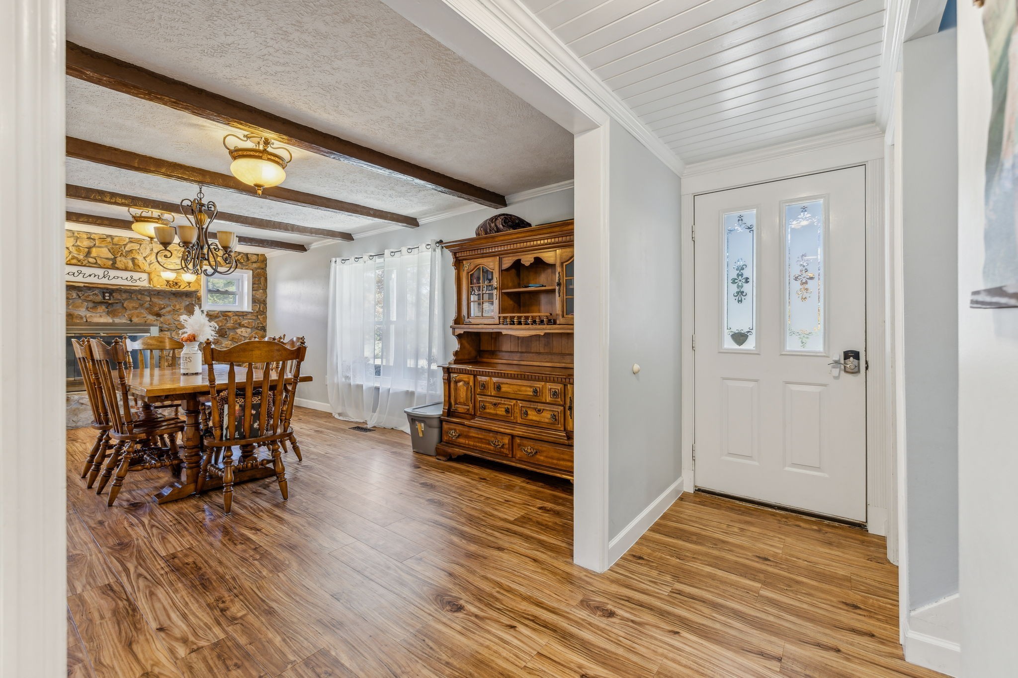 635 Cane Creek Road Hohenwald, TN 38462 - Photo 11 of 71 an empty room with wooden floor and furniture