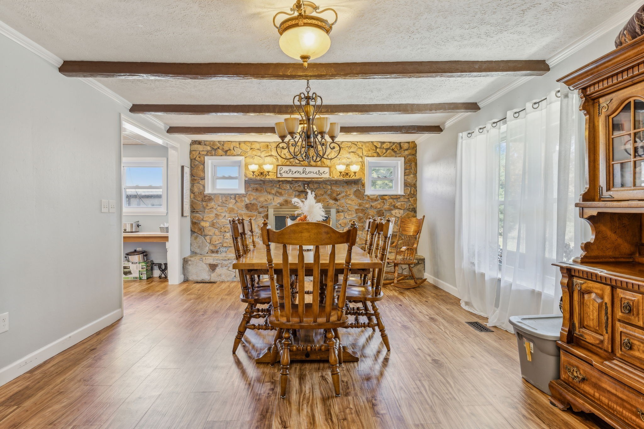 635 Cane Creek Road Hohenwald, TN 38462 - Photo 12 of 71 a view of a dining room with furniture wooden floor and chandelier