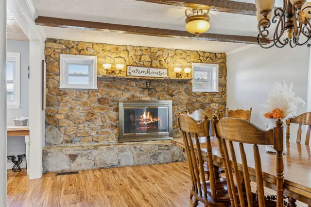 a kitchen with stainless steel appliances granite countertop a lot of counter space and wooden floors