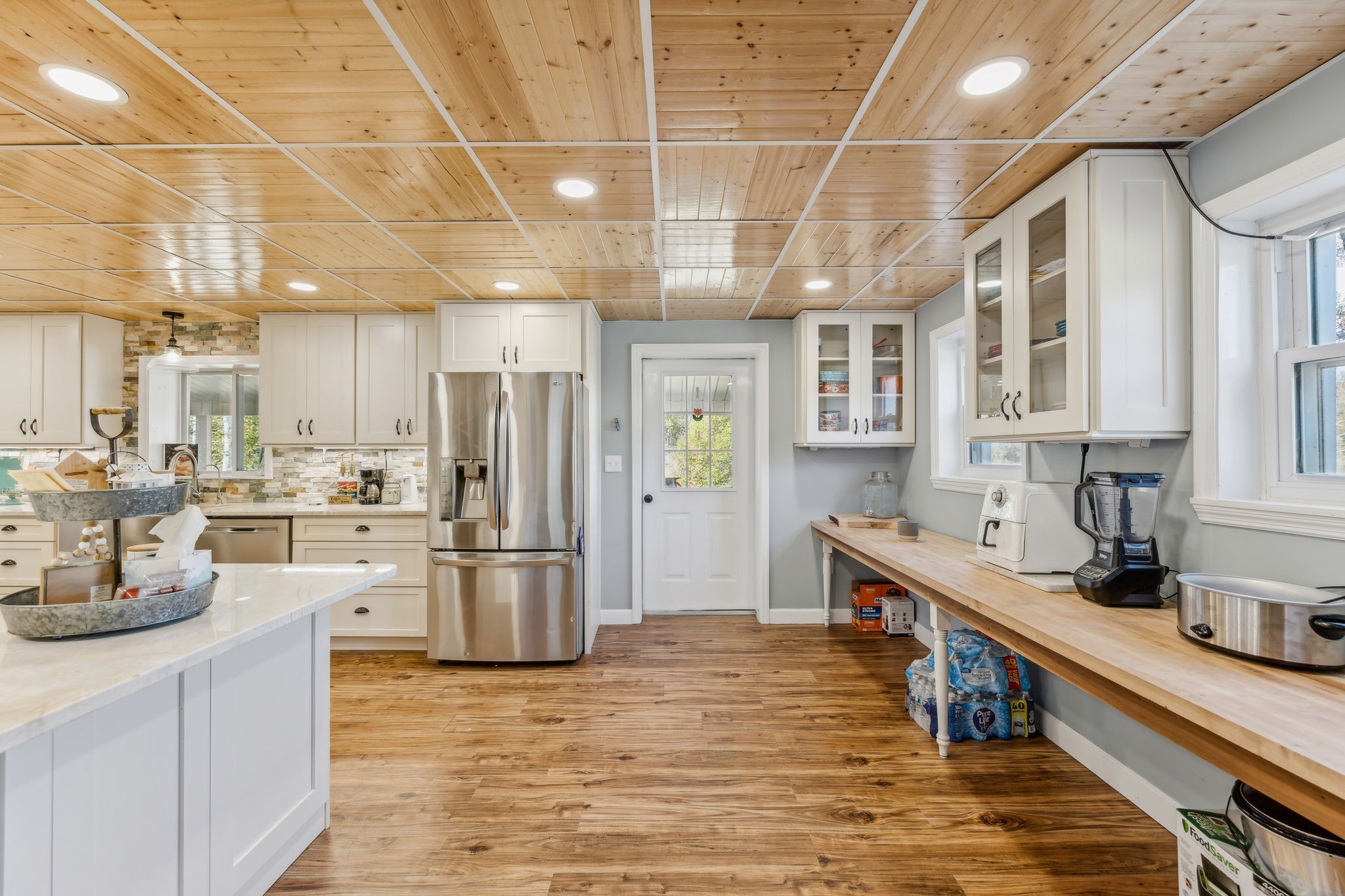 635 Cane Creek Road Hohenwald, TN 38462 - Photo 15 of 71 a kitchen with stainless steel appliances granite countertop a refrigerator a stove and a sink