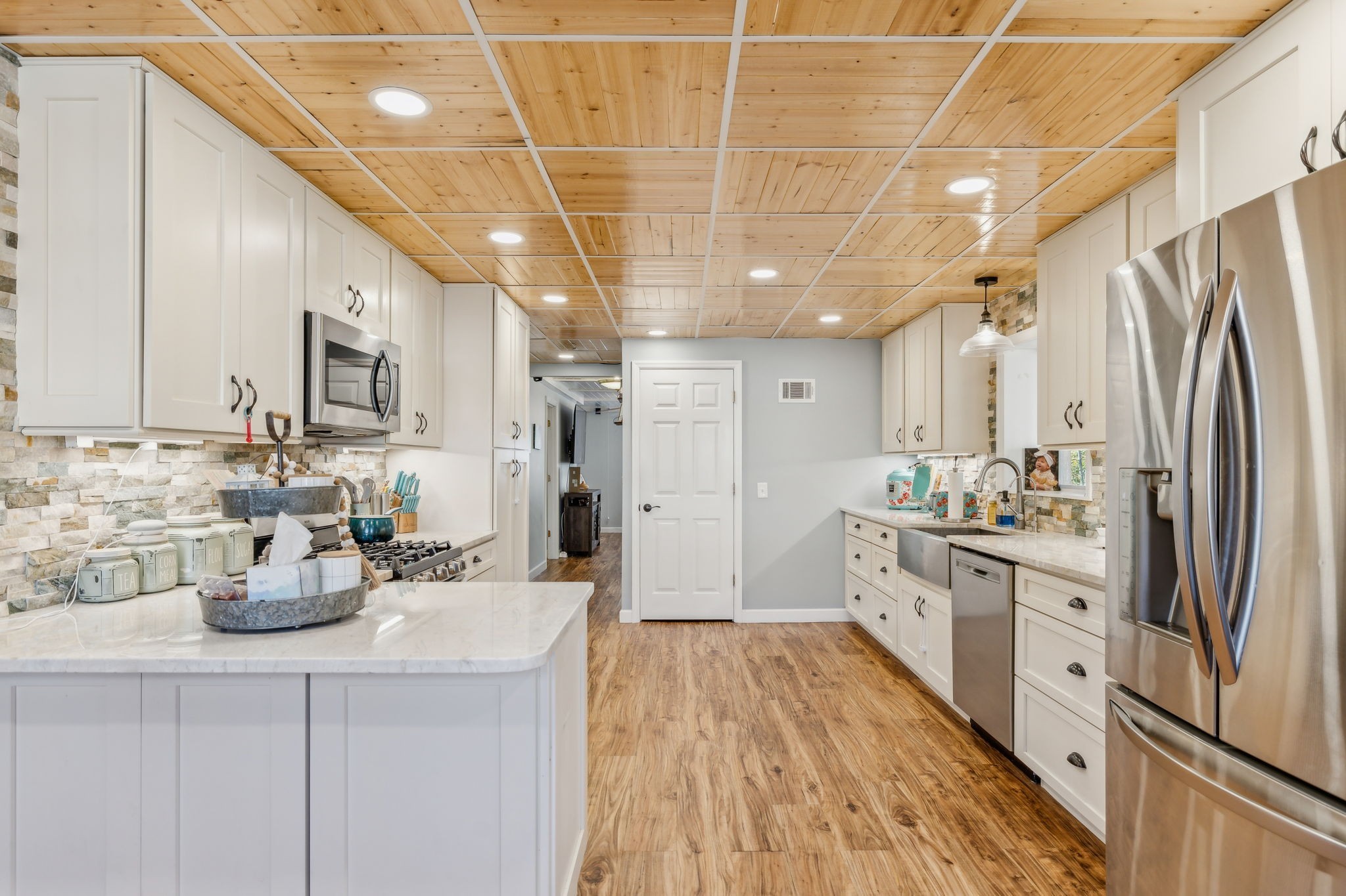 635 Cane Creek Road Hohenwald, TN 38462 - Photo 16 of 71 a kitchen with a refrigerator and a sink