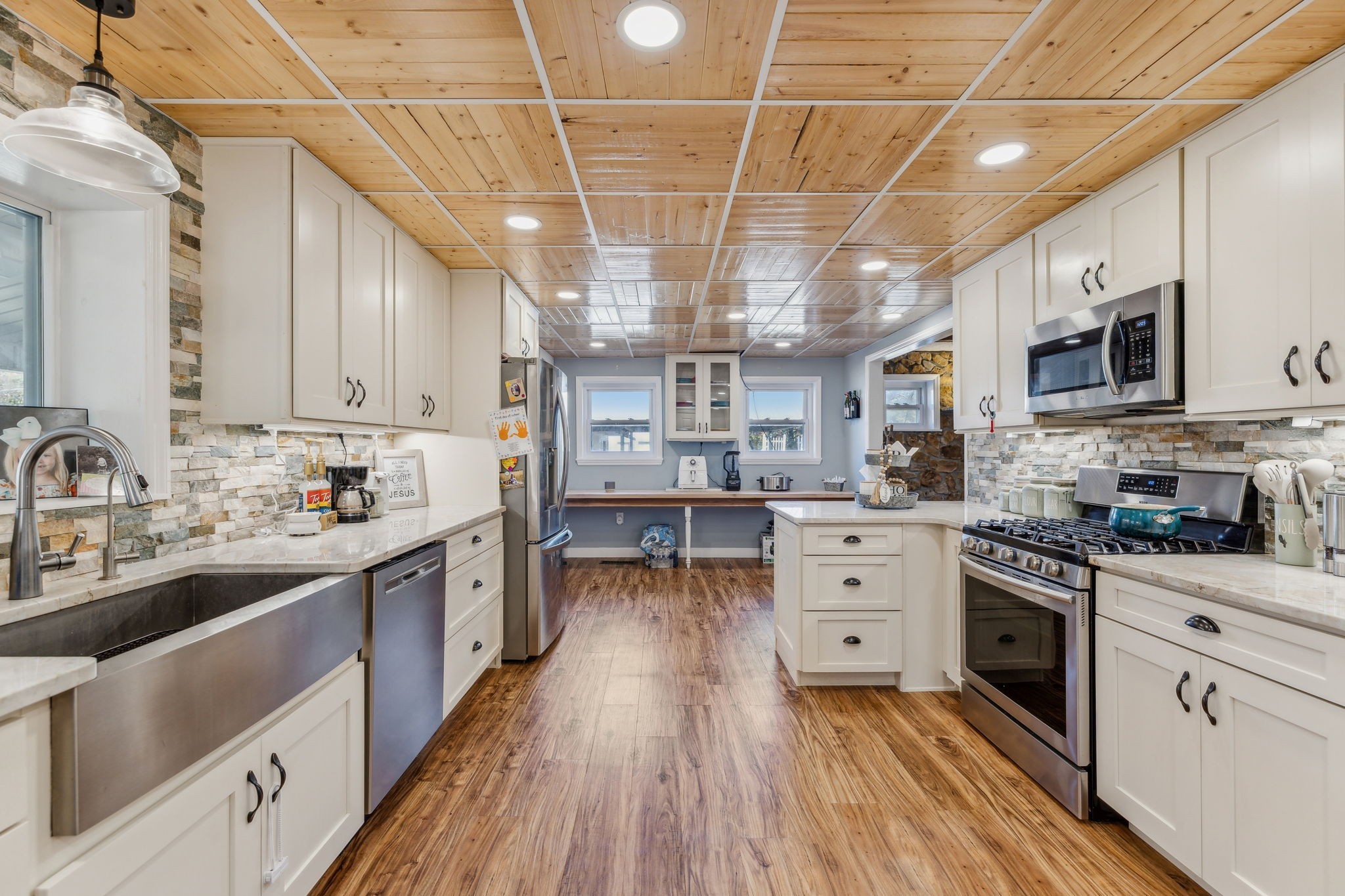 635 Cane Creek Road Hohenwald, TN 38462 - Photo 17 of 71 a kitchen with stainless steel appliances granite countertop a lot of counter space and wooden floors
