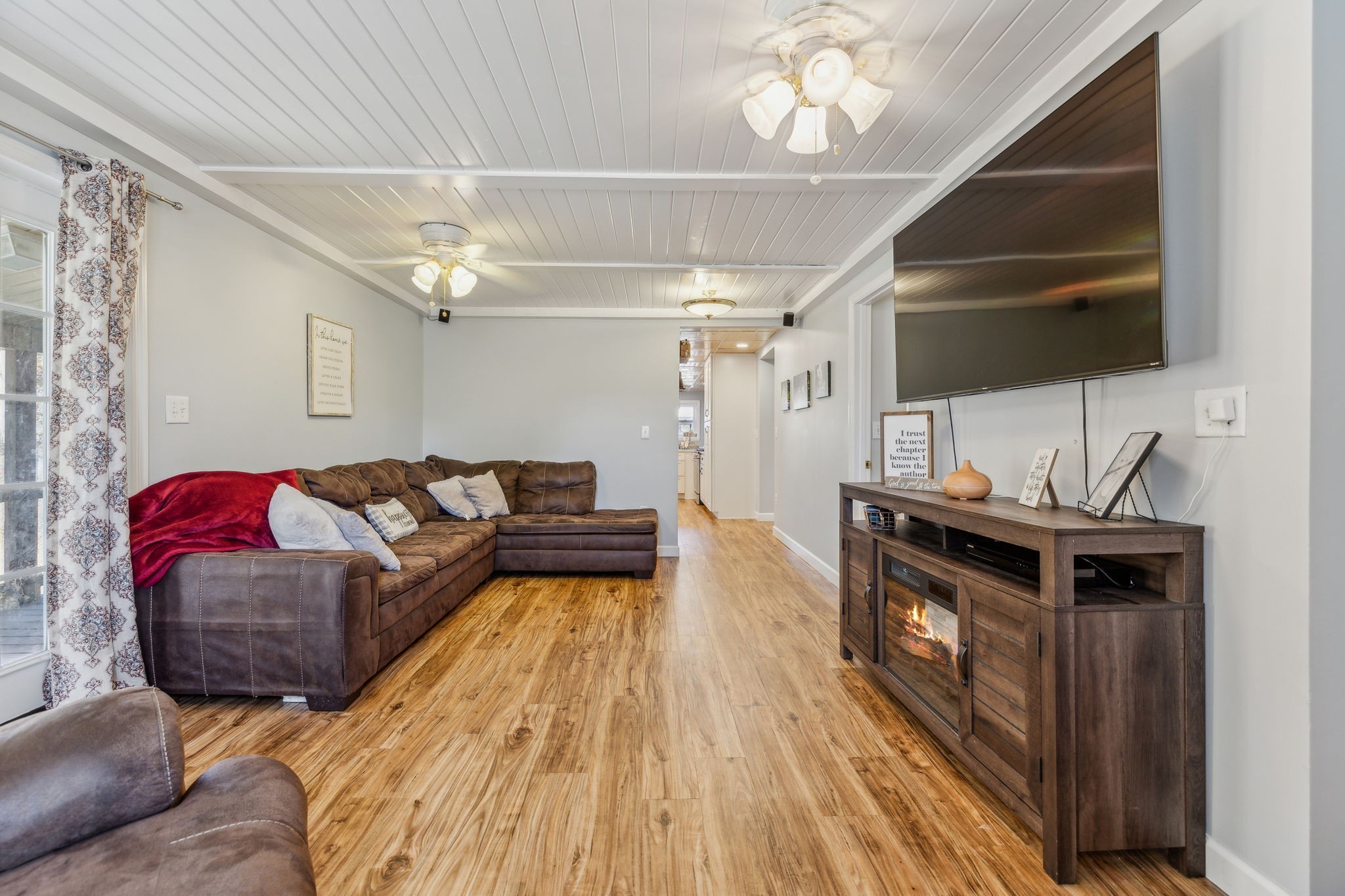 635 Cane Creek Road Hohenwald, TN 38462 - Photo 21 of 71 a living room with furniture and a wooden floor