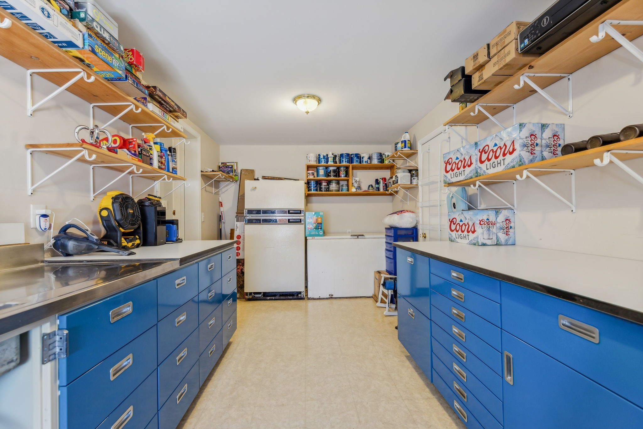 635 Cane Creek Road Hohenwald, TN 38462 - Photo 23 of 71 a kitchen with a wooden floor and cabinets