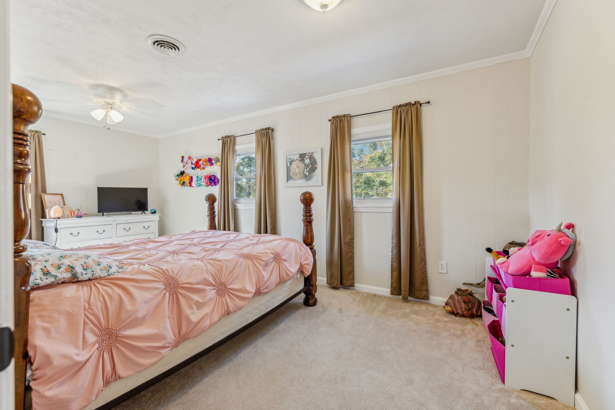 635 Cane Creek Road Hohenwald, TN 38462 - Photo 26 of 71 a bedroom with a bed and a flat screen tv