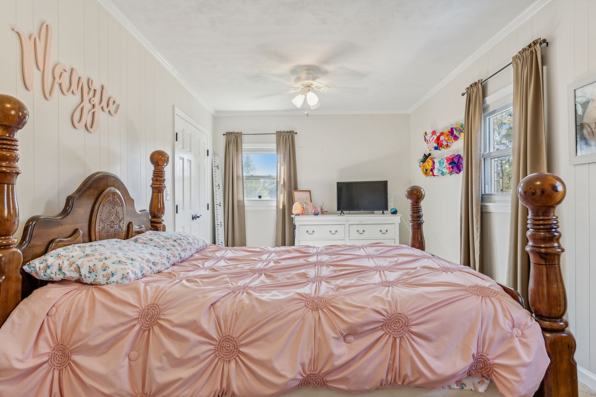 635 Cane Creek Road Hohenwald, TN 38462 - Photo 27 of 71 a bedroom with a bed and a flat screen tv