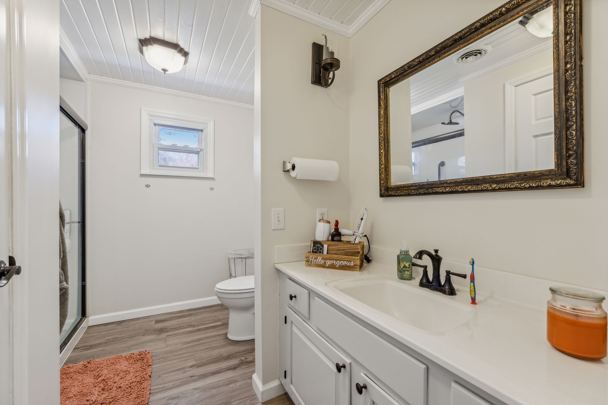 635 Cane Creek Road Hohenwald, TN 38462 - Photo 29 of 71 a bathroom with a toilet sink and mirror