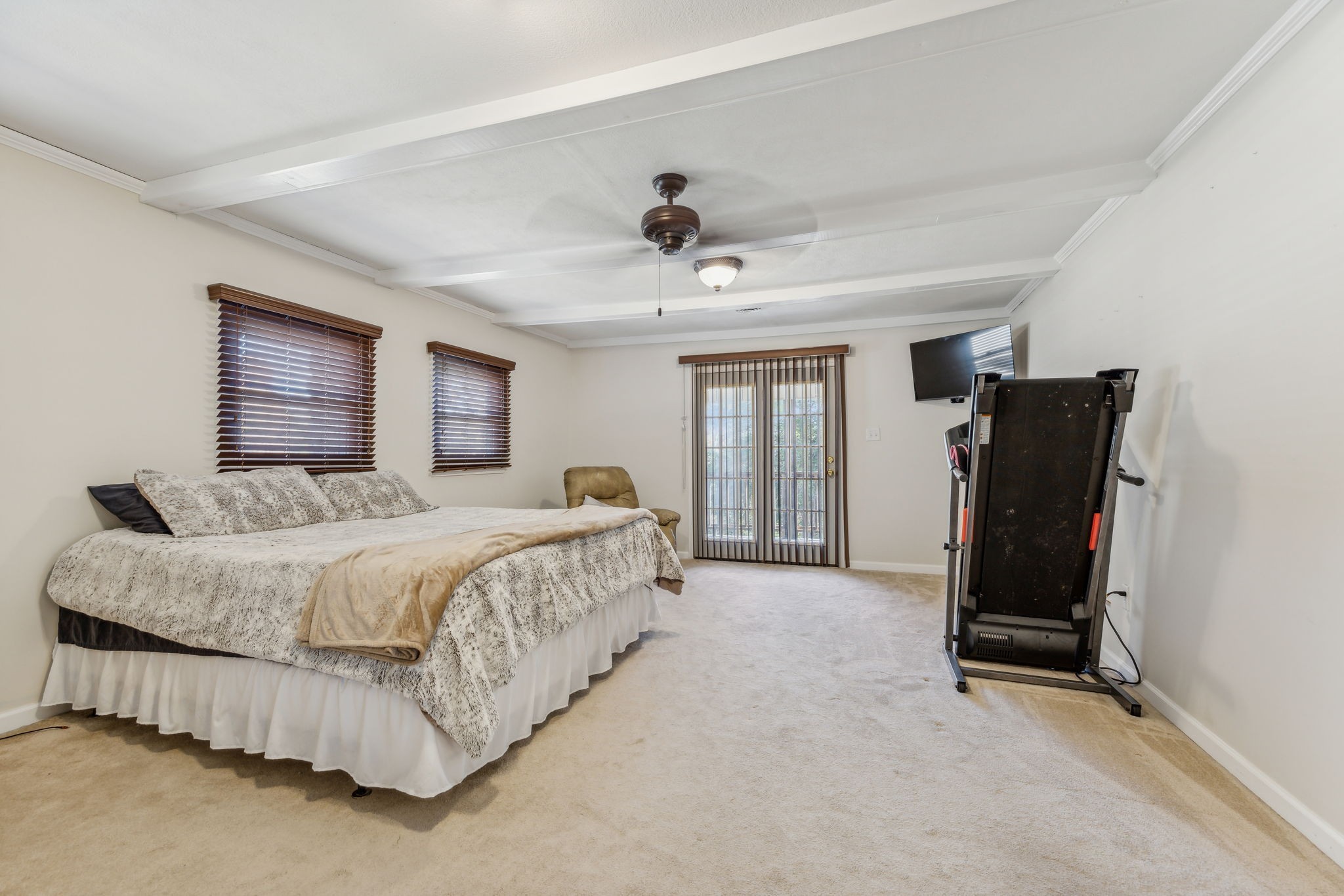 635 Cane Creek Road Hohenwald, TN 38462 - Photo 31 of 71 a spacious bedroom with a bed and ceiling fan