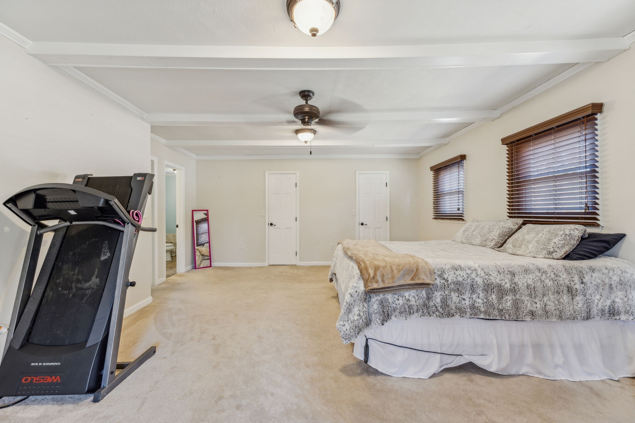 635 Cane Creek Road Hohenwald, TN 38462 - Photo 33 of 71 a bedroom with a bed and a ceiling fan