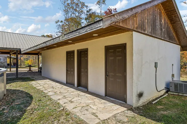 an aerial view of a house with a yard basket ball court and outdoor seating