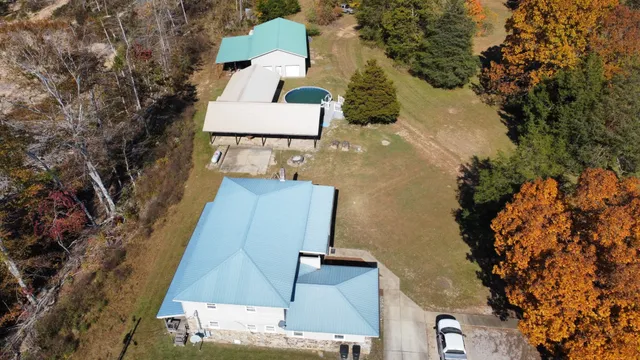 an aerial view of residential house and green space
