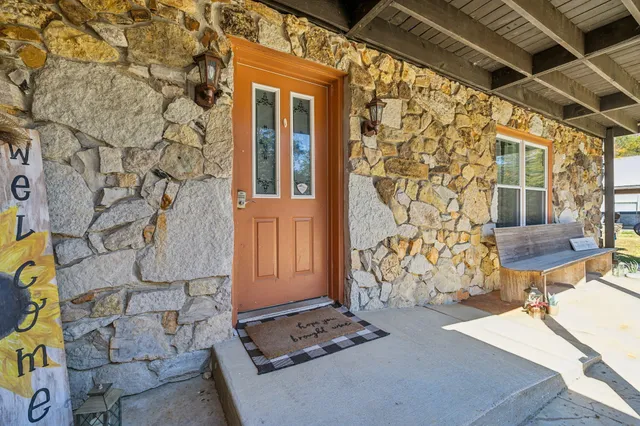 an empty room with wooden floor and furniture