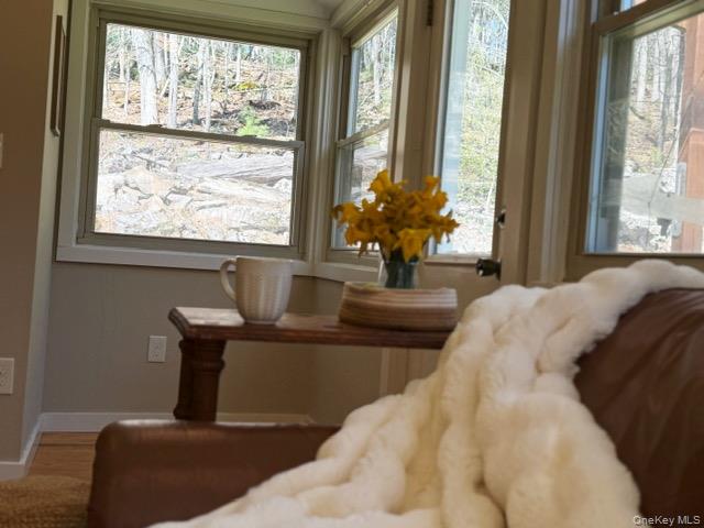 26 Woods Road Barryville, NY 12719 - Photo 14 of 34 a living room with a large window and a couches