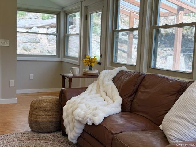 26 Woods Road Barryville, NY 12719 - Photo 2 of 34 a living room with furniture and large windows